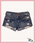 rebel summer — shorts denim con tachas